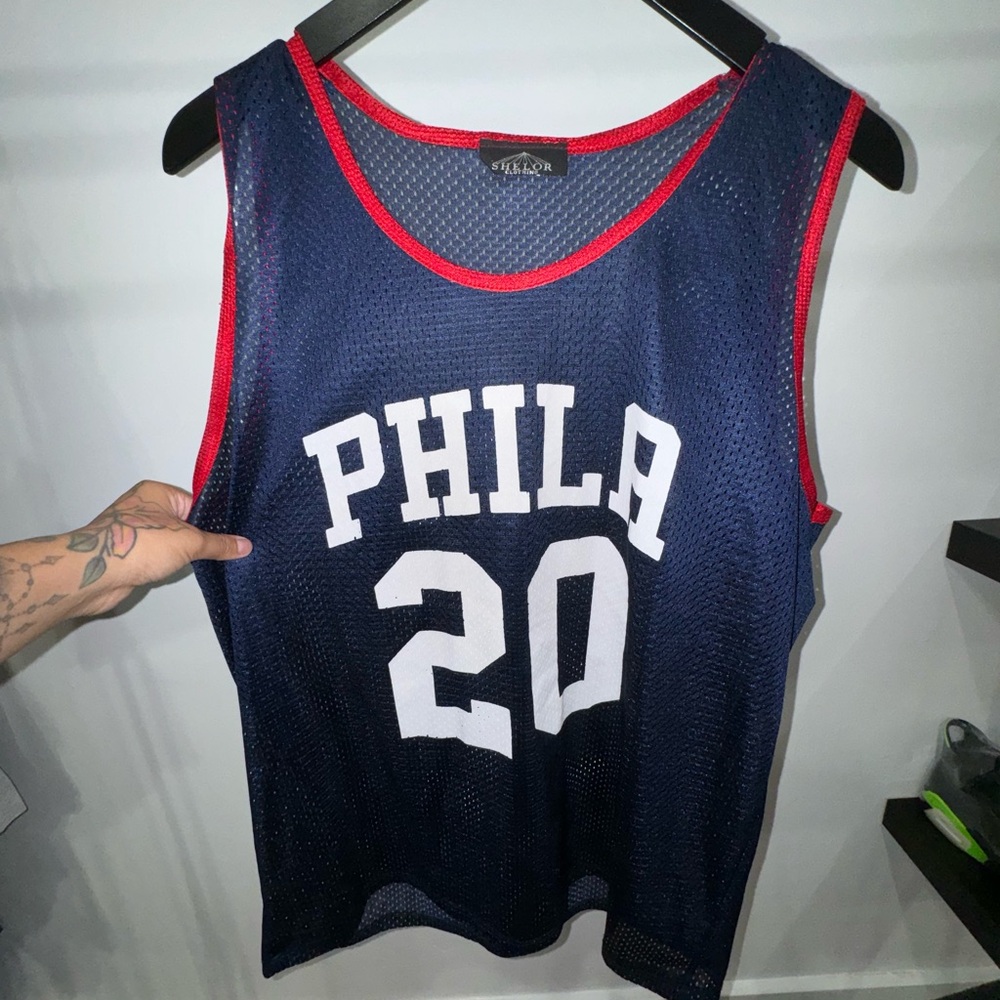 Blue and red Philadelphia 76ers jersey